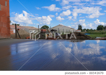 Masonry, Man leveling concrete slab for house terrace Masonry, Man leveling concrete slab for house terrace 88341670