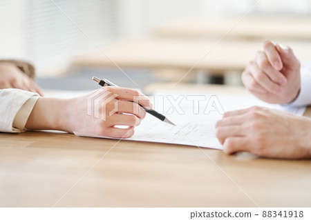 Asian real estate agent explaining the floor plan of real estate Asian real estate agent explaining the floor plan of real estate 88341918