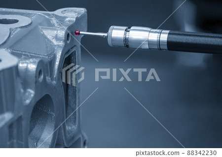 The multi-axis CMM machine measuring the cylinder head parts . The multi-axis CMM machine measuring the cylinder head parts . 88342230