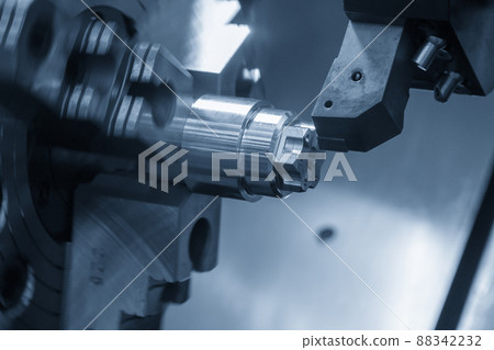 The  CNC lathe machine forming  cutting the metal shaft parts. 88342232