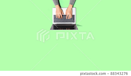 Person using a laptop computer Person using a laptop computer 88343276