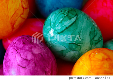 Pascal colorful eggs in a basket, a celebration of spring. 88345154