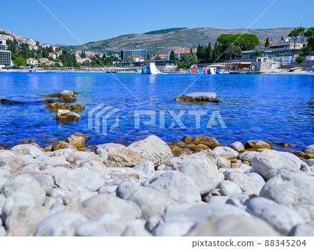 Blue clear beach on the shore of the city of Dubrovnik Blue clear beach on the shore of the city of Dubrovnik 88345204