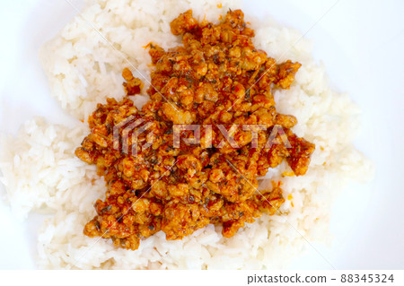White plate with rice and cooked minced meat. White plate with rice and cooked minced meat. 88345324
