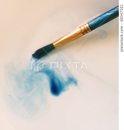 Brush closeup dip with watercolor paint Brush closeup dip with watercolor paint 88347381