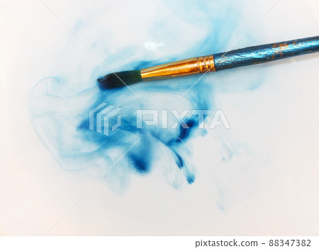 Brush closeup dip with watercolor paint Brush closeup dip with watercolor paint 88347382
