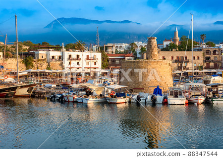 Scenic view of Kyrenia (Girne) harbour with mountains on background. Cyprus 88347544