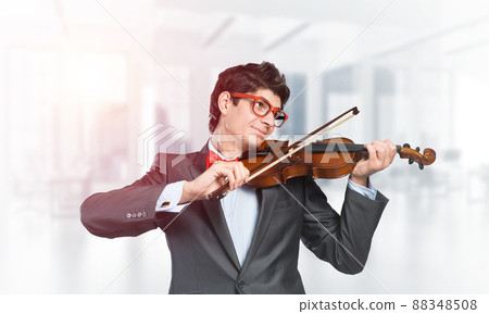 young musician plays the violin 88348508