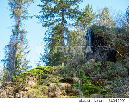 The waterfall of Tuefels Chilen in the hills around Zurich, Switzerland, is famous for its sedimentary tuff structure. 88349001