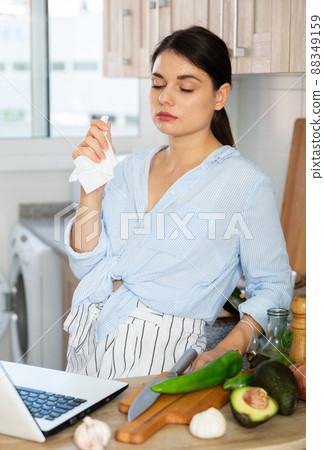 Portrait of adult sad woman tired of worries at kitchen 88349159