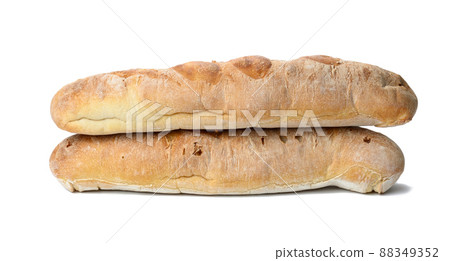 two baked baguettes made from white wheat flour on a white background two baked baguettes made from white wheat flour on a white background 88349352