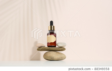 template with brown glass bottle with pipette on a beige background. Collagen skin. Aromatherapy concept. Mockup skincare cosmetic product. 88349358