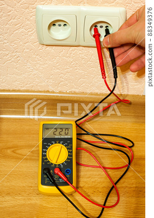 Metering socket voltage with modern digital multimeter. Metering socket voltage with modern digital multimeter. 88349376