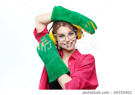portrait of an attractive blonde in protective glasses and gloves 88350402