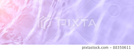 Serum or water texture close up. Light purple and pink gradient liquid gel background. Transparent beauty skincare sample. Cosmetic clear liquid cream smudge. Long banner with copy space 88350611