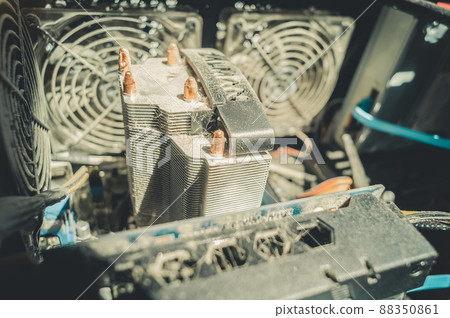 Dusty radiator of the cooling system of the computer processor. Dirt on the fins of the radiator. Selective focus 88350861