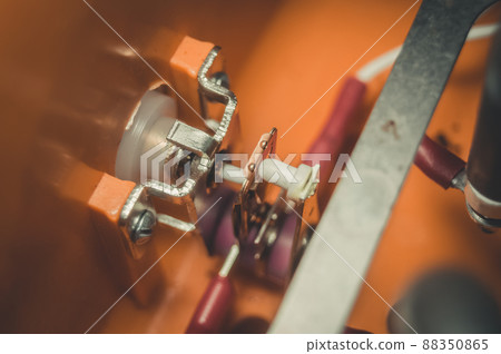 Analog temperature controller in an electric dryer for dehydrating vegetables and fruits. Repair of home drying equipment. Selective focus 88350865