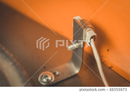 Temperature sensor inside an electric dryer for vegetables and fruits. Repair of household appliances. Selective focus 88350873