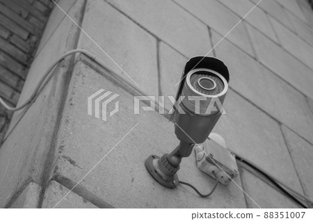 CCTV camera home security system of an apartment building. Street surveillance. Selective focus CCTV camera home security system of an apartment building. Street surveillance. Selective focus 88351007