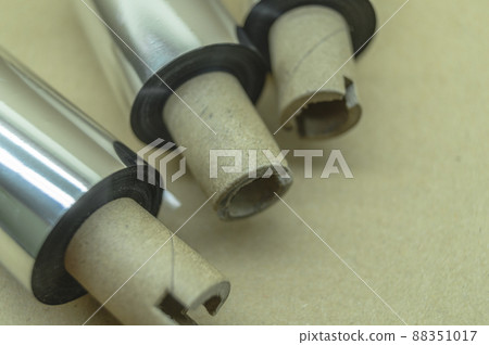 Thermal transfer ribbon - TTR. Wax thermo ribbon on cardboard reel for barcode. Supply material for printing industry. Selective focus 88351017