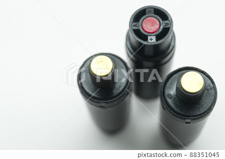 Aerosol pepper cartridges for a protective gun. Means of self-defense against attacks by aggressive people and animals. Selective focus, isolated on white, copy space Aerosol pepper cartridges for a protective gun. Means of self-defense against attacks by aggressive people and animals. Selective focus, isolated on white, copy space 88351045