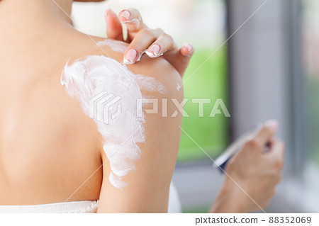 Beauty woman with moisturizer concept in the bathroom 88352069