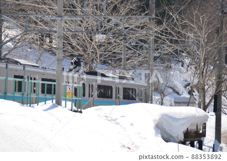 Trains that stop at the heavy snow station platform Trains that stop at the heavy snow station platform 88353892