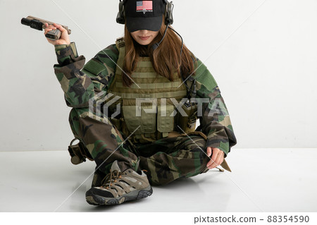 Female soldier sitting down Female soldier sitting down 88354590