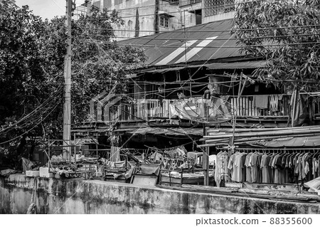 Black - White Asian Thailand slum zone with rooftop, electric pole, tree, satellite in picture Black - White Asian Thailand slum zone with rooftop, electric pole, tree, satellite in picture 88355600