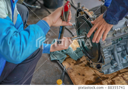 2 mechanic men try to fix and setup boat engine. 2 mechanic men try to fix and setup boat engine. 88355741