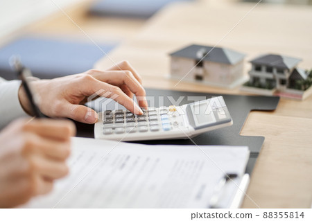 Asian man taking a real estate quote 88355814