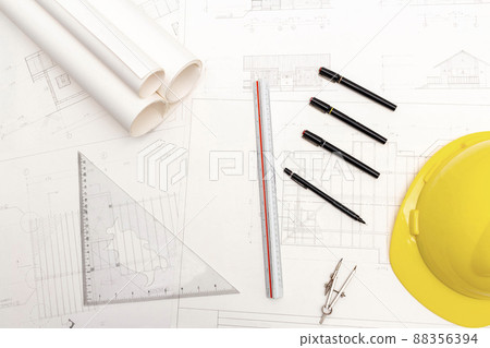 Mockup of architectural concept, Drawing tools and engineer drawing on blueprint with safety helmet Mockup of architectural concept, Drawing tools and engineer drawing on blueprint with safety helmet 88356394
