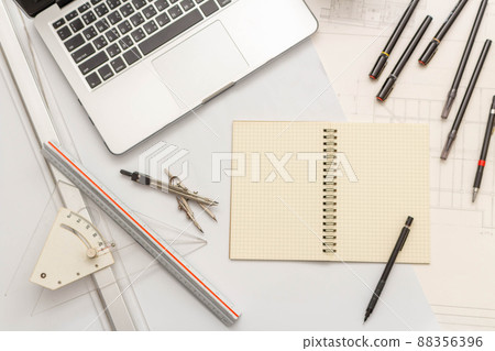 Mockup of architectural concept, Drawing tool on engineer drawing of blueprint and white background Mockup of architectural concept, Drawing tool on engineer drawing of blueprint and white background 88356396