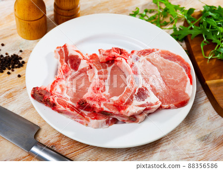 Fresh raw pork loin chops with condiments Fresh raw pork loin chops with condiments 88356586