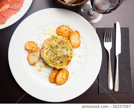 Salmon tartare with guacamole served on plate Salmon tartare with guacamole served on plate 88357087