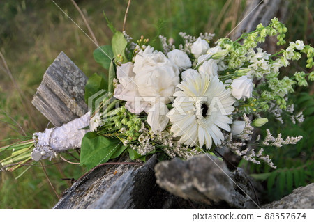 Bouquet of Assorted White Flowers Including Gerber Daisies, Roses, Peonies on Split Rail Fence 88357674