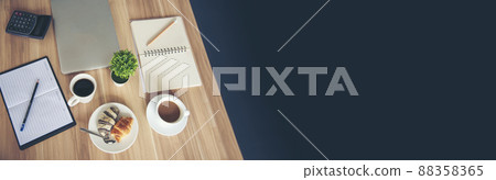 Banner Office laptop business financial document chart and graph on office wooden table coffee cup. Panorama Flat lay notebook computer laptop on office desk. Business stuff mockup with copy space 88358365