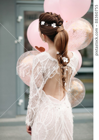 Slim stunning brunette with flowers in her hair 88360755