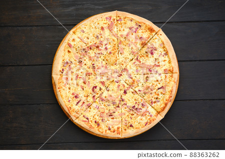Pizza with parma ham, red onion and cheese Pizza with parma ham, red onion and cheese 88363262