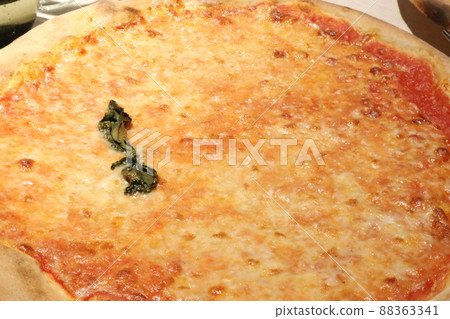 A photo of the entire traditional Milanese pizza Margherita. 88363341