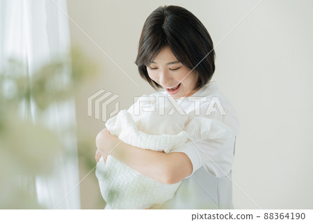 Mother holding a baby Mother holding a baby 88364190
