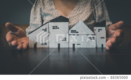 Housing Loan and Real Estate Broker Selling Agency Concept. Business Woman Hands Offer House Model to Customer for Sale,Rent. Business House Realty Agent and Residential Investment. 88365000