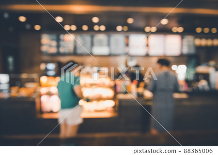 Blur Coffee Cafe Shop and Bokeh Light Bulb Background. Defocused Image and Blur Customer People in Coffee Counter Shop. Blur Cafe Store Shop Lifestyles and Client Service Food Event Blur Coffee Cafe Shop and Bokeh Light Bulb Background. Defocused Image and Blur Customer People in Coffee Counter Shop. Blur Cafe Store Shop Lifestyles and Client Service Food Event 88365006