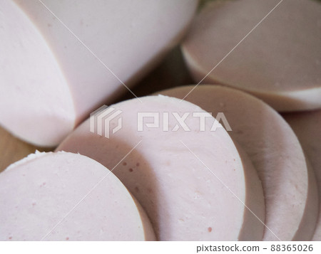 Boiled sausage cut into pieces, a close-up shot. Boiled sausage cut into pieces, a close-up shot. 88365026