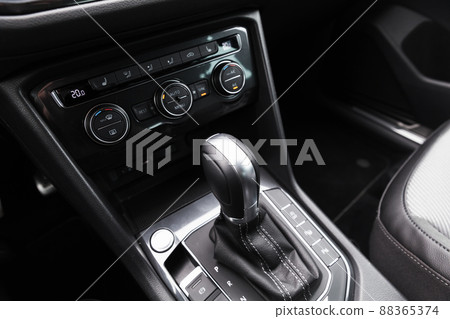 Gear lever and climate control panel of modern luxury crossover car 88365374
