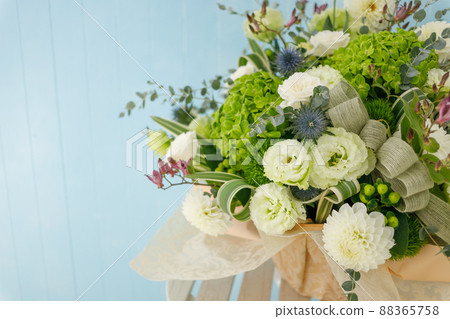 Flower arrangement on blue background 88365758