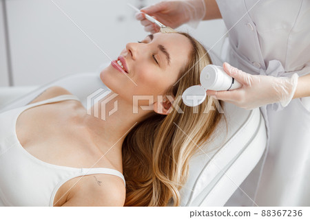 Young woman having skincare procedure in beauty salon Young woman having skincare procedure in beauty salon 88367236