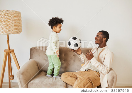 Father and Son with Football Ball Father and Son with Football Ball 88367946