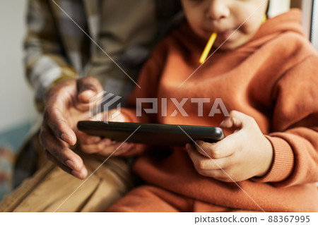 Little Toddler Holding Smartphone Close Up 88367995