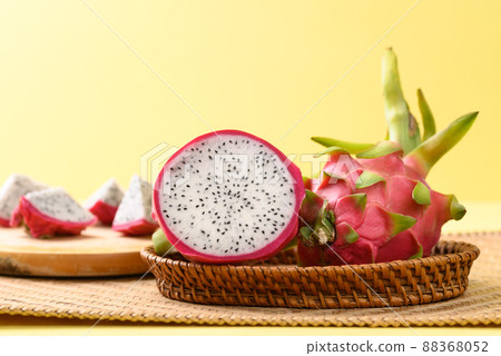 Fresh dragon fruit or pitaya in basket on yellow background, Tropical fruit 88368052